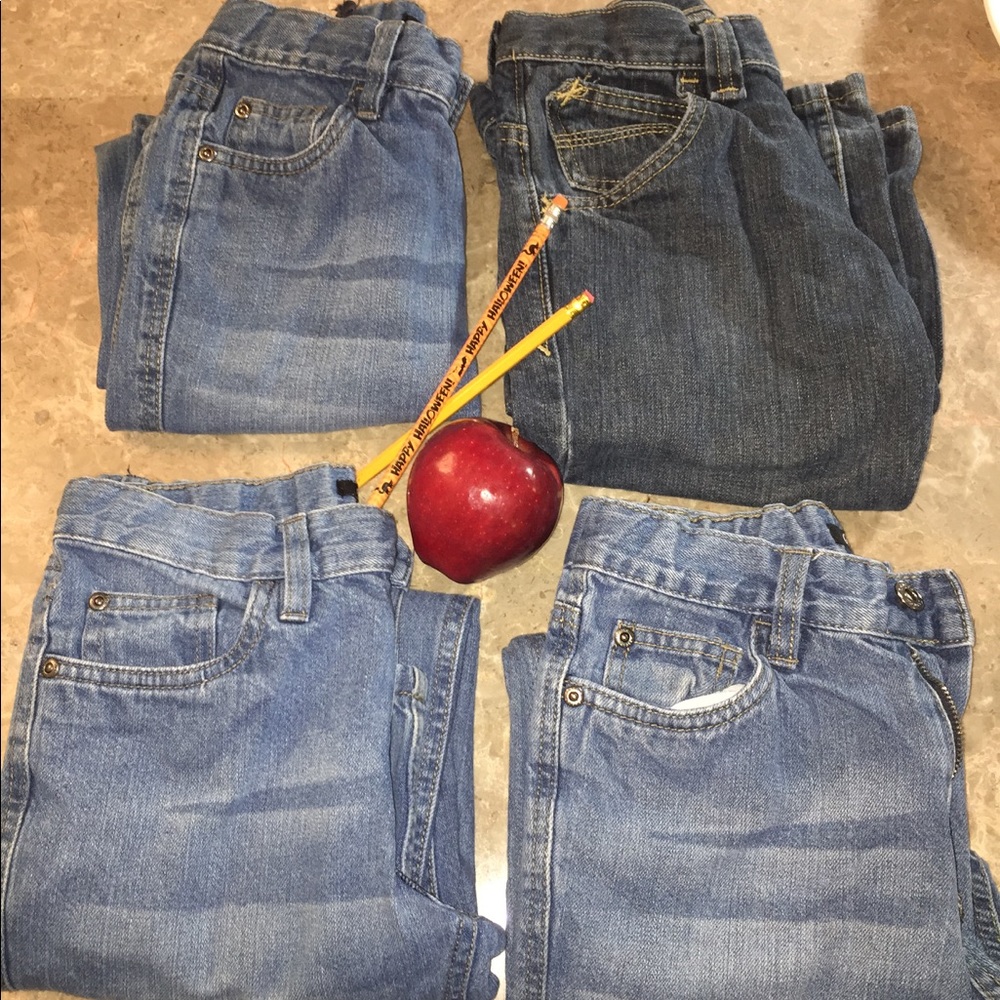 Four pairs of boys jeans.