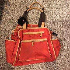 Skip Hop diaper bag with Skip Hop pacifier holder