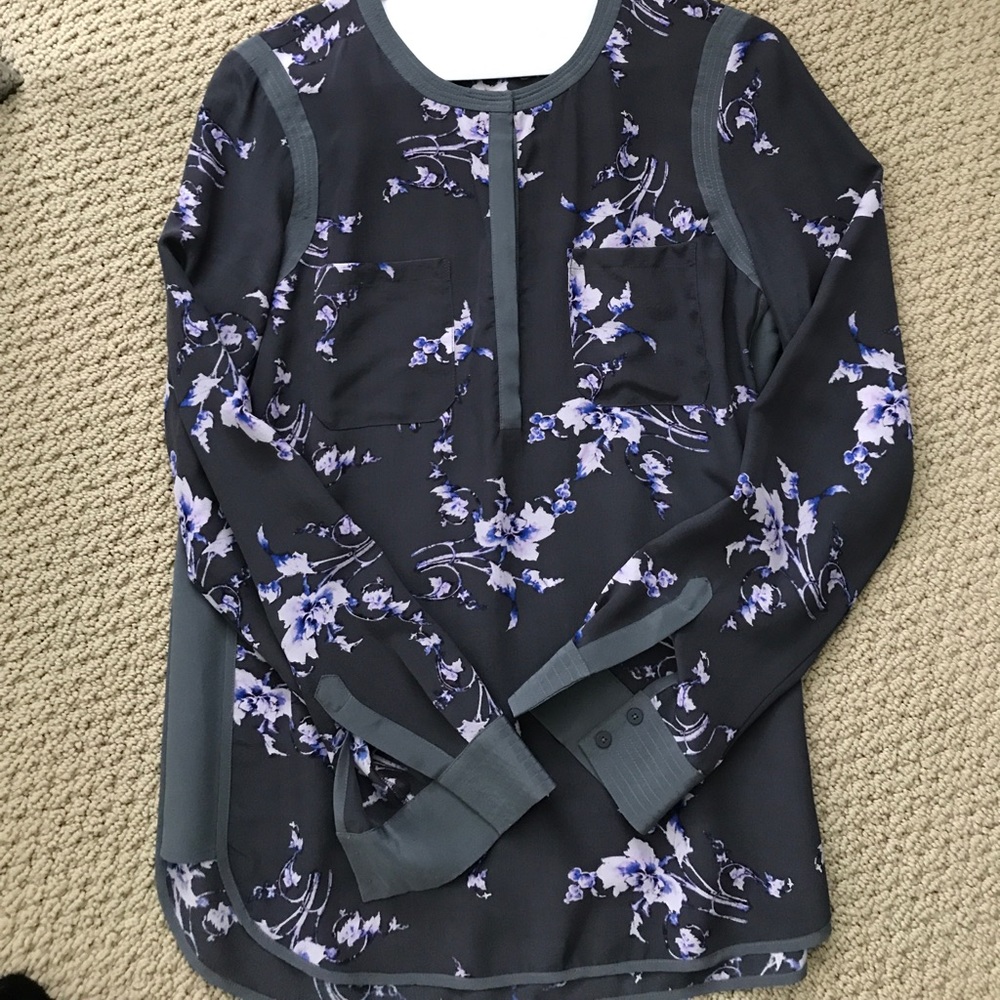 Gray floral blouse with 1/3 snaps in front.