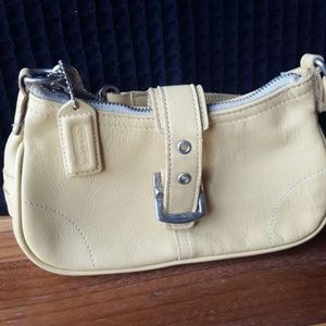 Soft yellow coach mini handbag