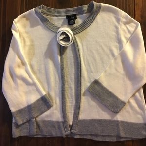 Grey and white sweater.