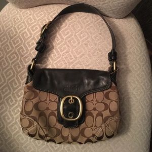 Over the shoulder Coach purse with black strap