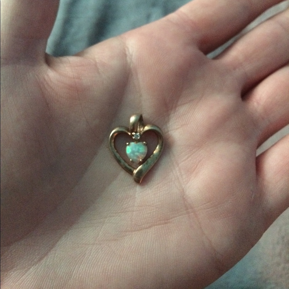 Opal inside gold heart pendant