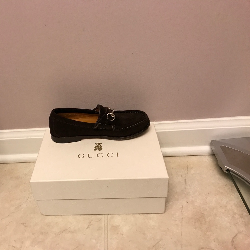 Brown Gucci loafers with silver detail