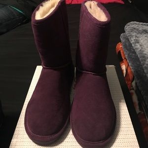 Purple colored bear paw boots
