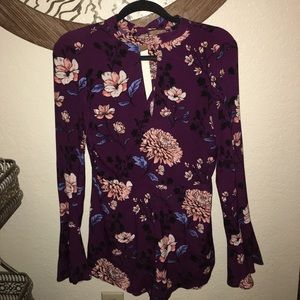 Brand new with tags long sleeve romper.