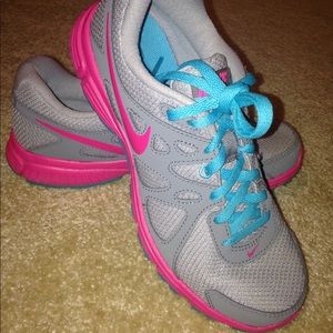 Nike gray, pink and blue running shoes