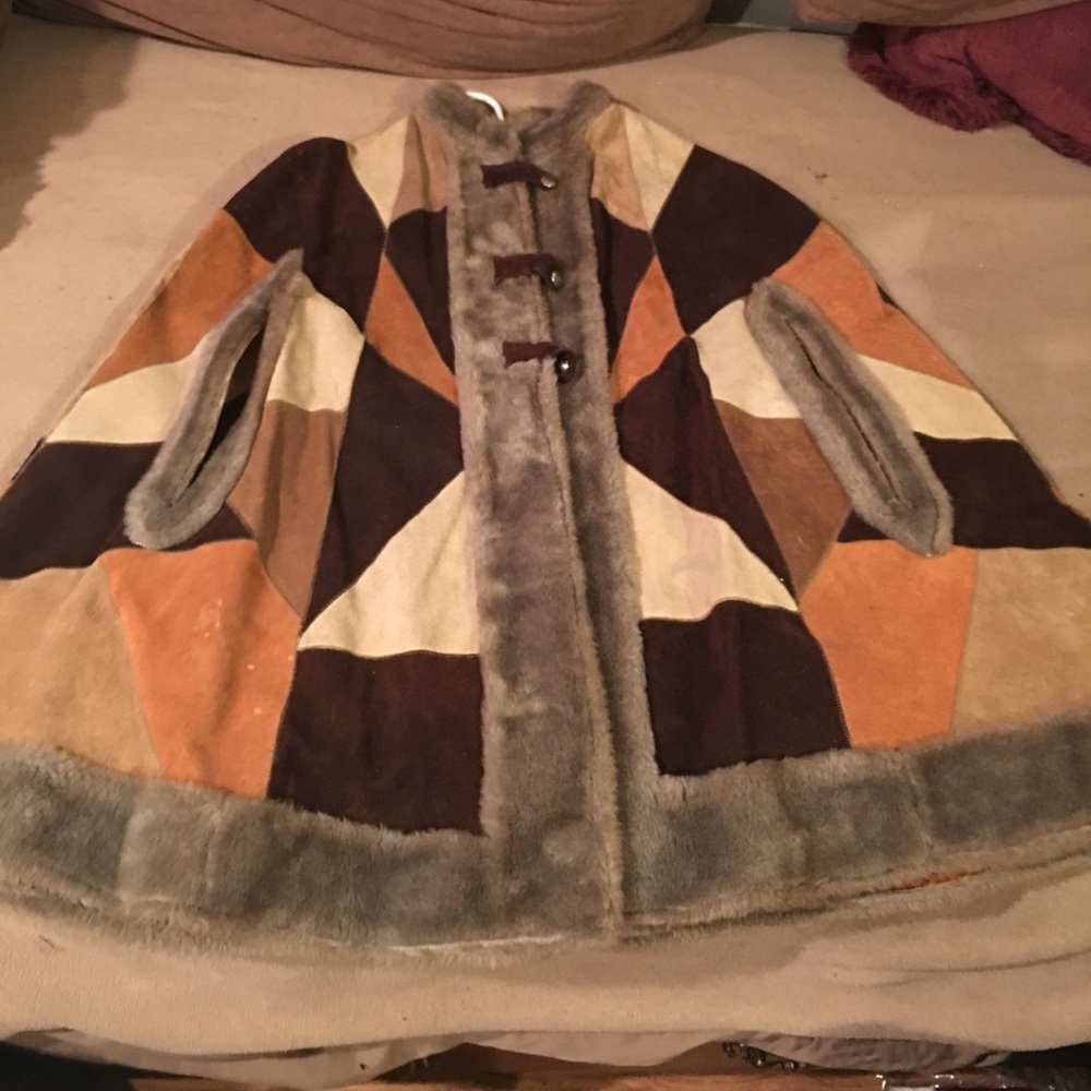 Leather patchwork poncho with faux fur trim