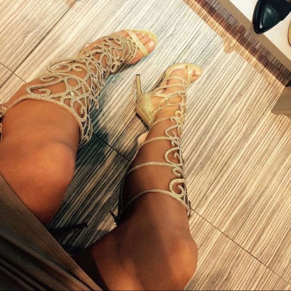 Knee high gold heels