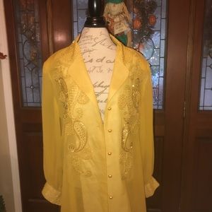 Women’s oversized blouse with pearl and sequins.