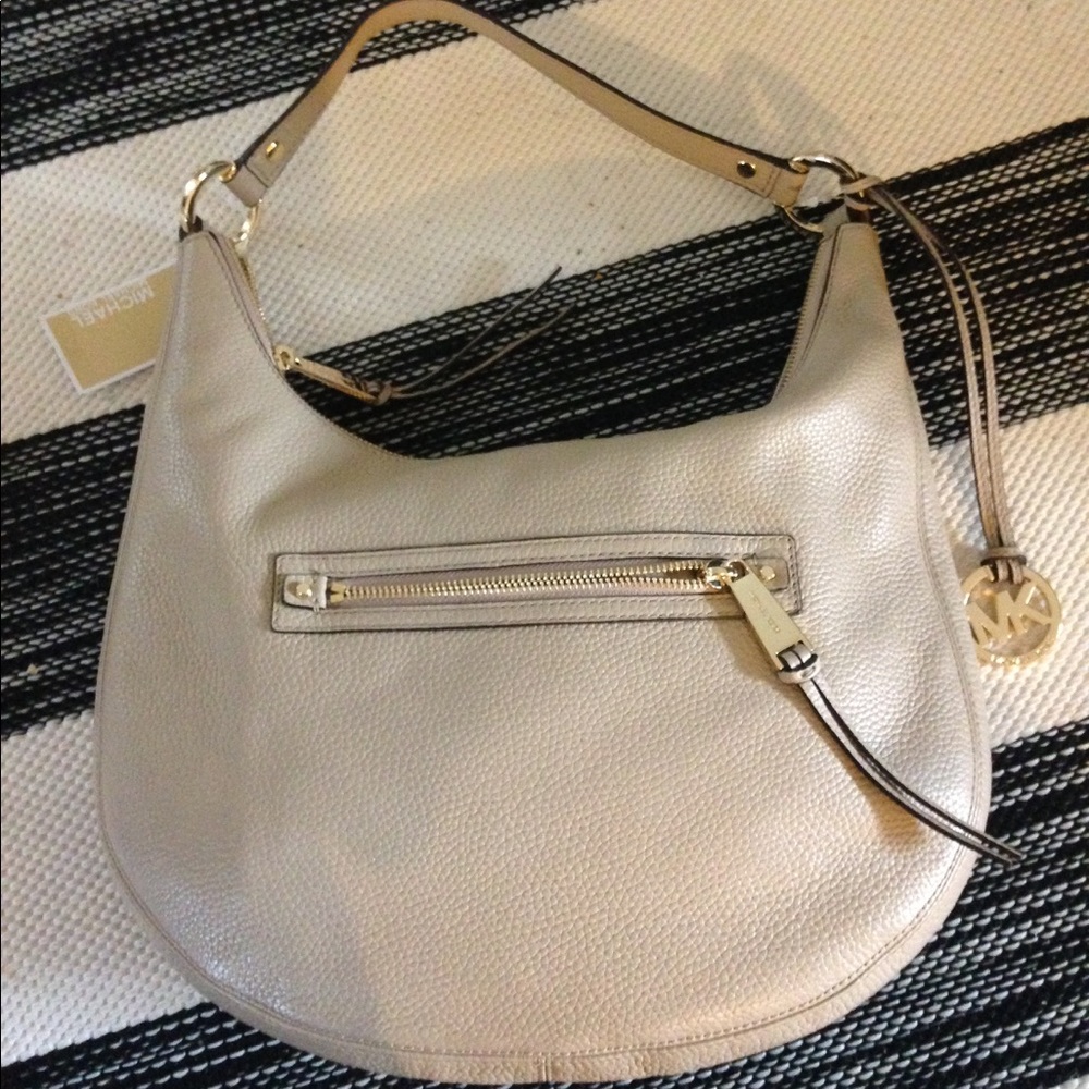 Michael Kors Authentic Mid-zip shoulder bag.