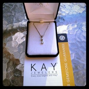 Three square stone diamond necklace.