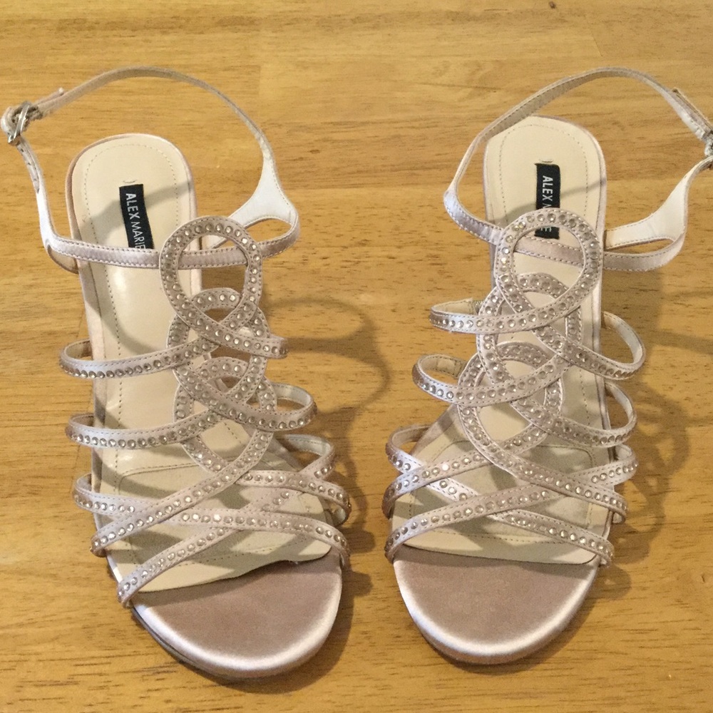 Gold dressy sandals with 3 inch heels.