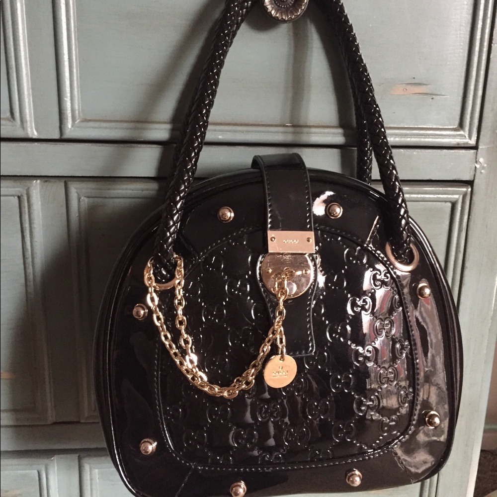 GUCCI black round bag with gold chain and lock