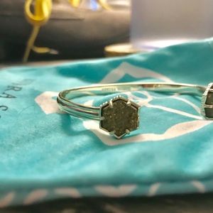 Silver and brown Kendra Scott bangle.