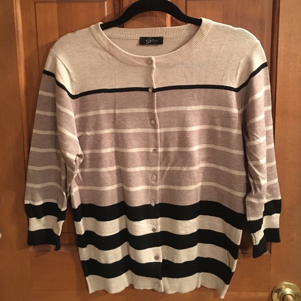 Women’s tan cardigan with classic black stripes.