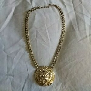 Gold lion face necklace