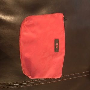 small dark red accessory bag