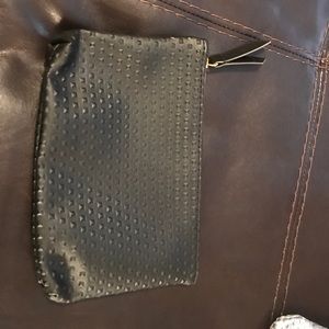 small black studded accessory bag