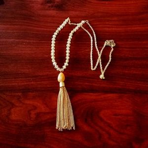 Long beaded neclace with a chain tassel pendant