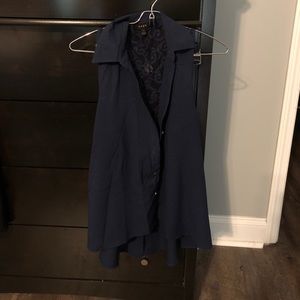 Blue sleeveless button down shirt