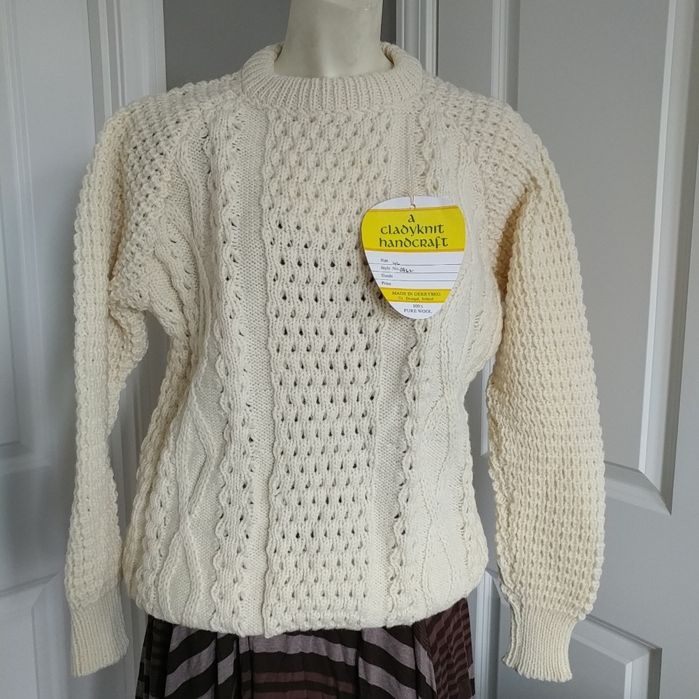 Handwooven knit cardigan sweater.