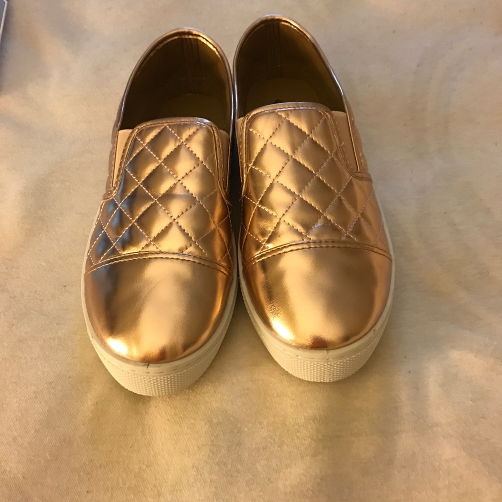 Gold metallic slip on sneakers. Never worn.
