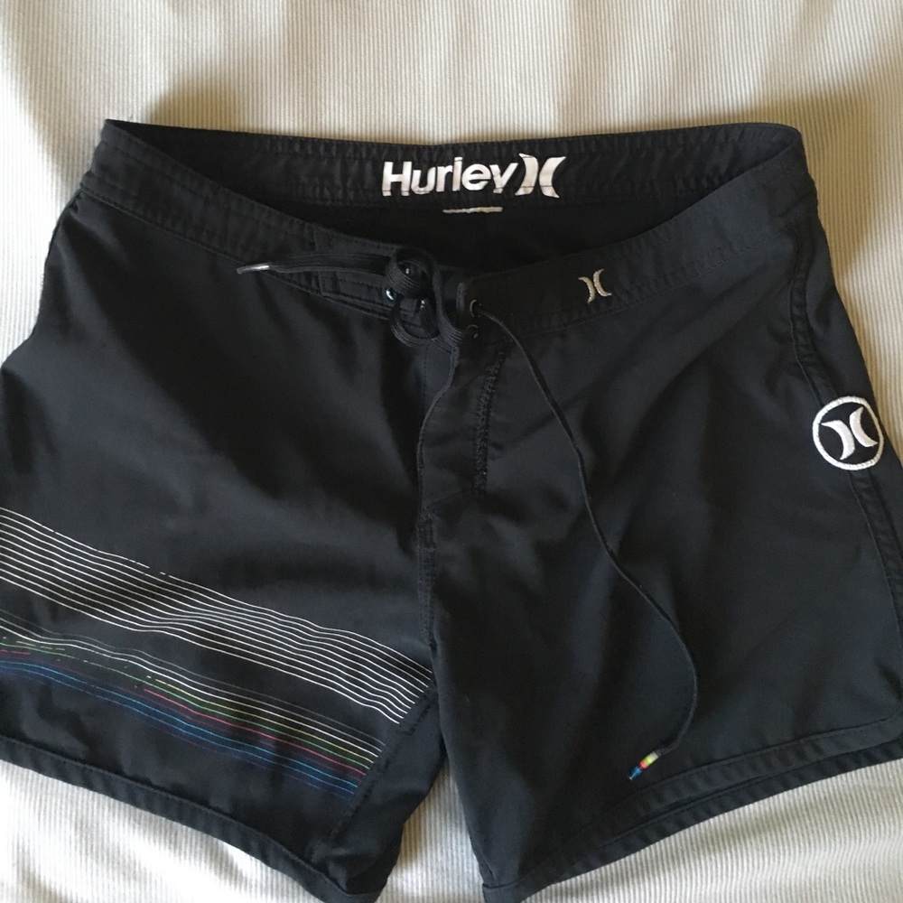 striped Hurley board shorts.