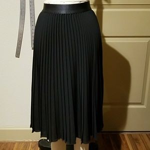Pleated black midi skirt