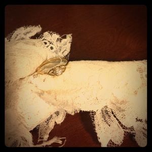 Gold ring, white stone.