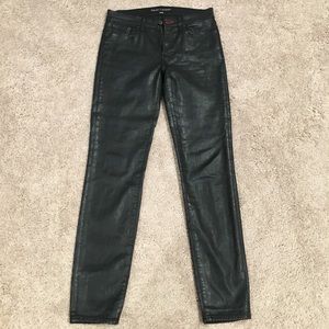 Wax coated black skinny jeans