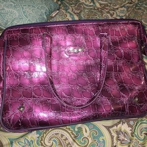 Kathy Van Zeeland Purple crocodile overnight bag.