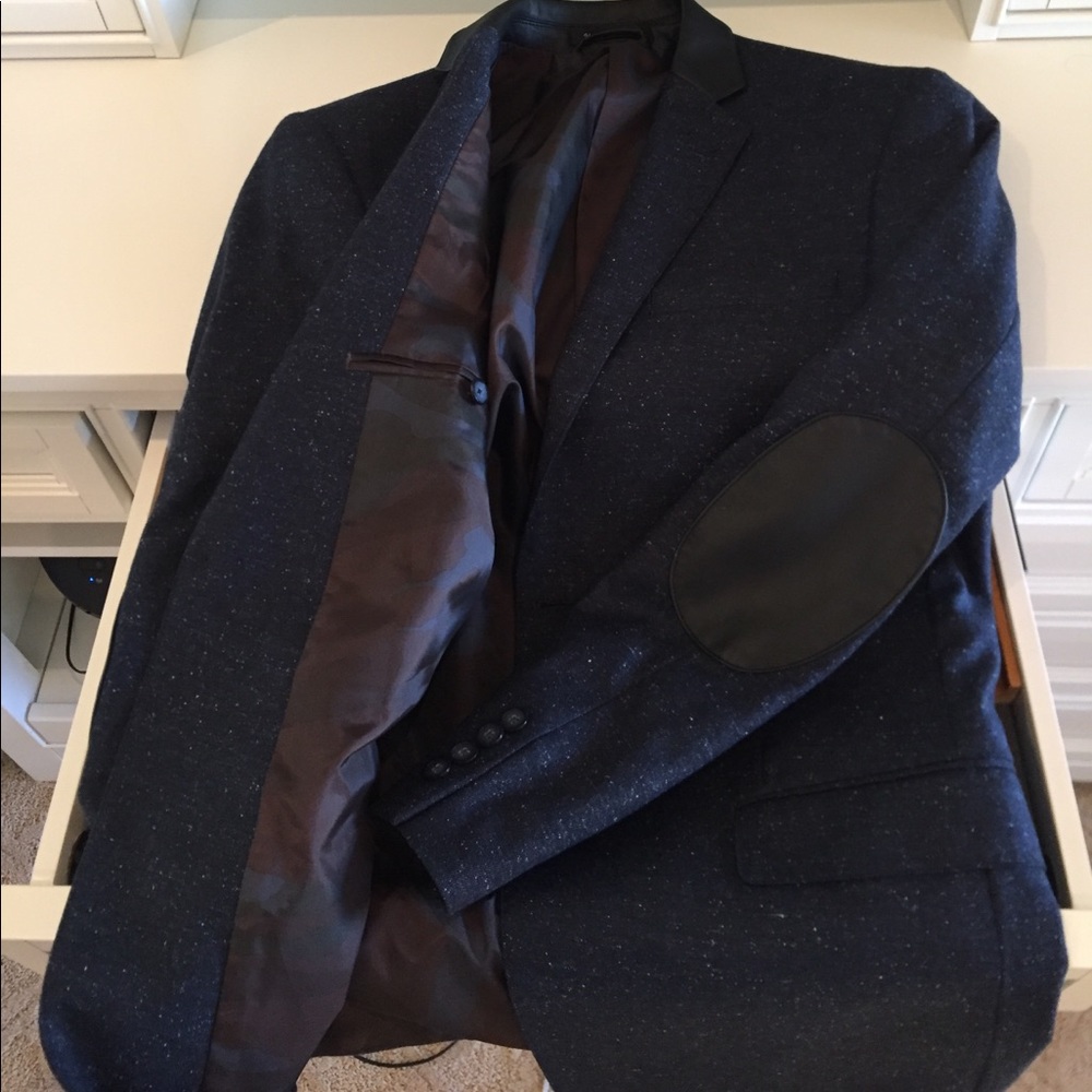 Andrew Marc navy blue sports coat.