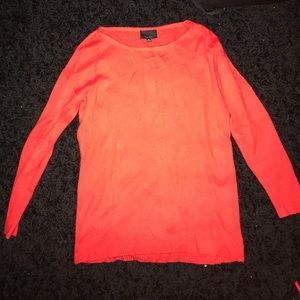 orange/ red sweater