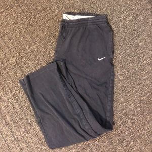 Woman’s dark blue nike sweats