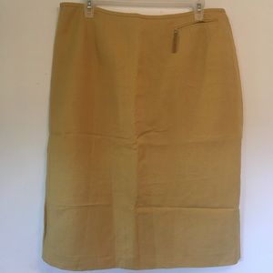 Mustard yellow pencil skirt. Small pocket w/split