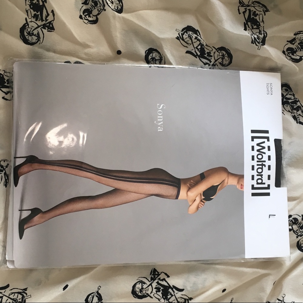Wolford- Sonya tights . NWT fishnets with sideseem