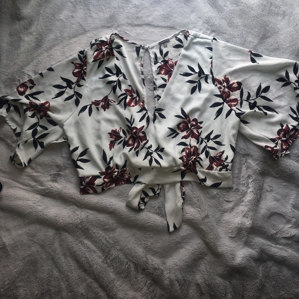 Teal crop top that ties in the back with flowers