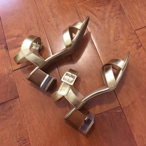 Lulu's fashionable gold platform heels
