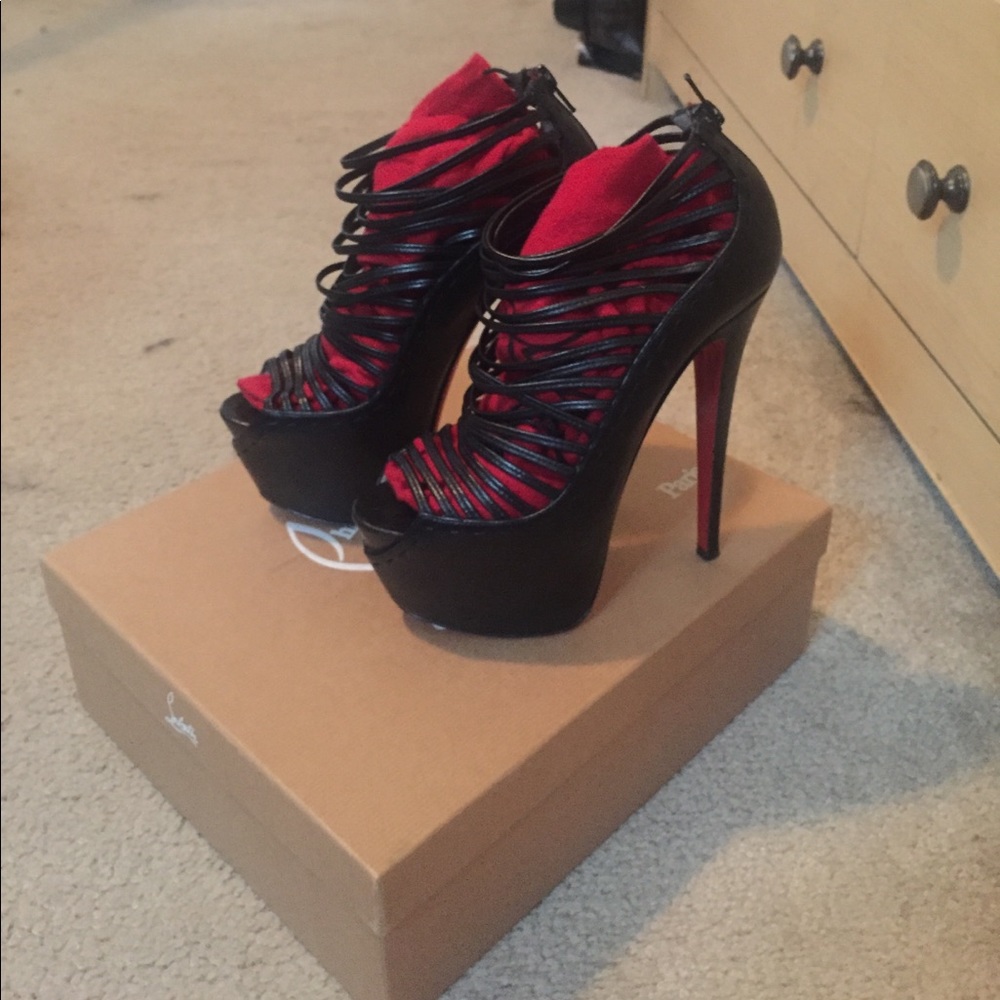 CHRISTIAN LOUBOUTIN BLACK ZOULOU HEELS .