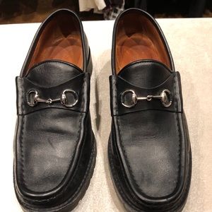 Black Gucci loafers with lug sole