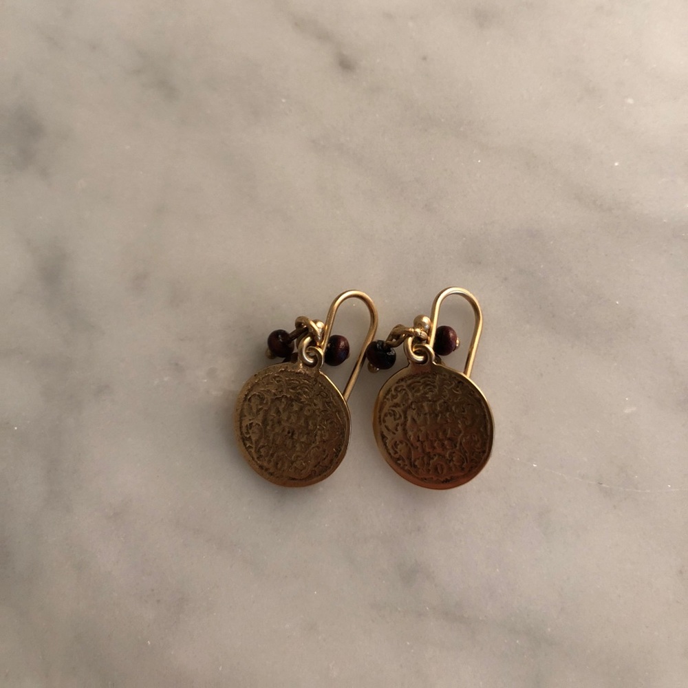 Gold earrings measuring 1/2 inch