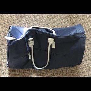 Avon’s Silver & Navy Blue Convertible Duffle Bag