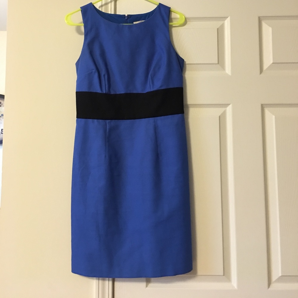 Blue dress with black band around waist