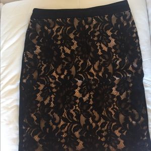 Bebe lace black and nude skirt. Gently worn.