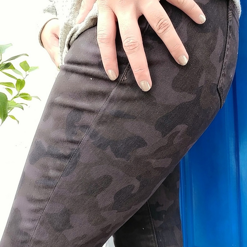 Distressed camo jeans