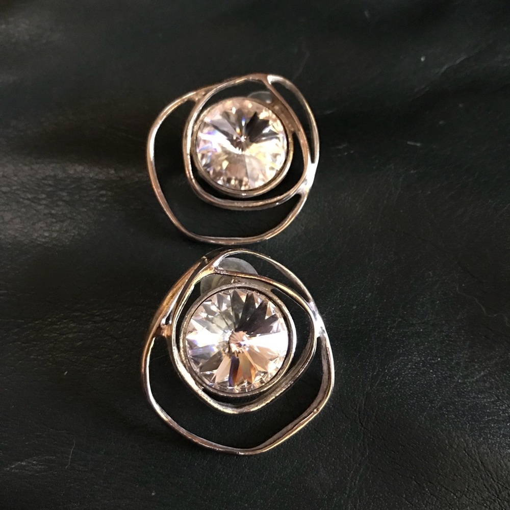 Silver earrings with glass like stone
