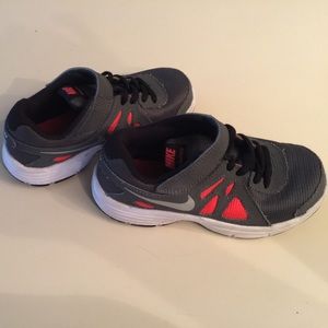 Nike Grey and orange Velcro strap boy shoes.