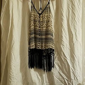 Beautiful tank top with fringe bottom.