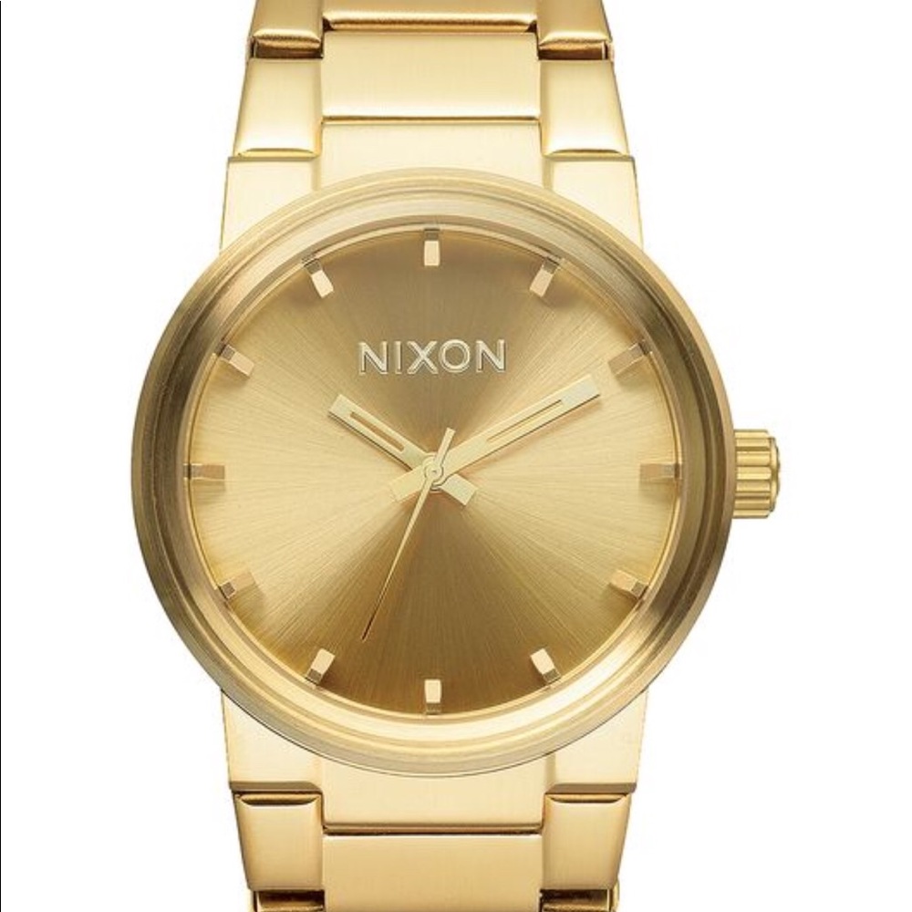 Gold authentic Nixon men’s watch. Links included